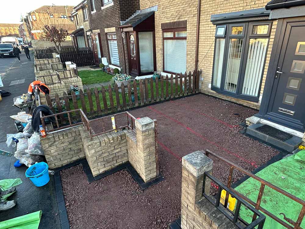 A resin bound front garden / garden path / driveway project underway in Edinburgh