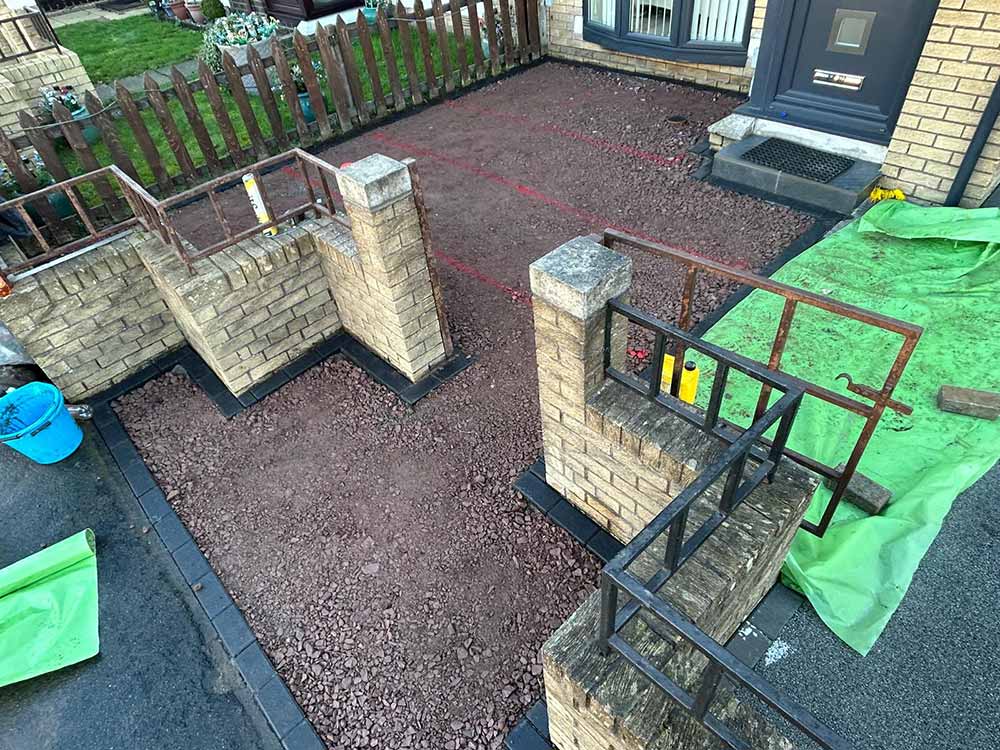 A resin bound front garden / garden path / driveway project underway in Edinburgh